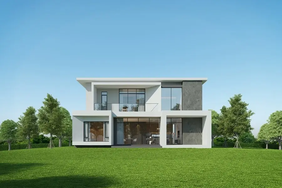 An exterior of a sophisticated bunglow painted in white
