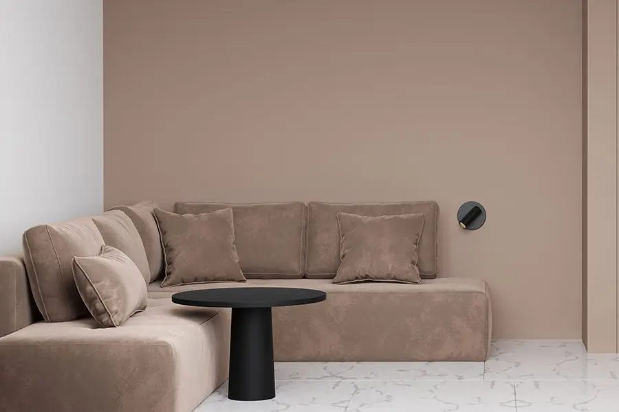 Contemporary living room with cream walls, minimalist decor, and natural light