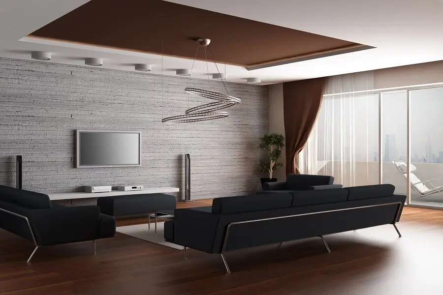 Cozy living room with gray walls, modern furniture, and warm lighting, creating a welcoming and relaxed ambiance.